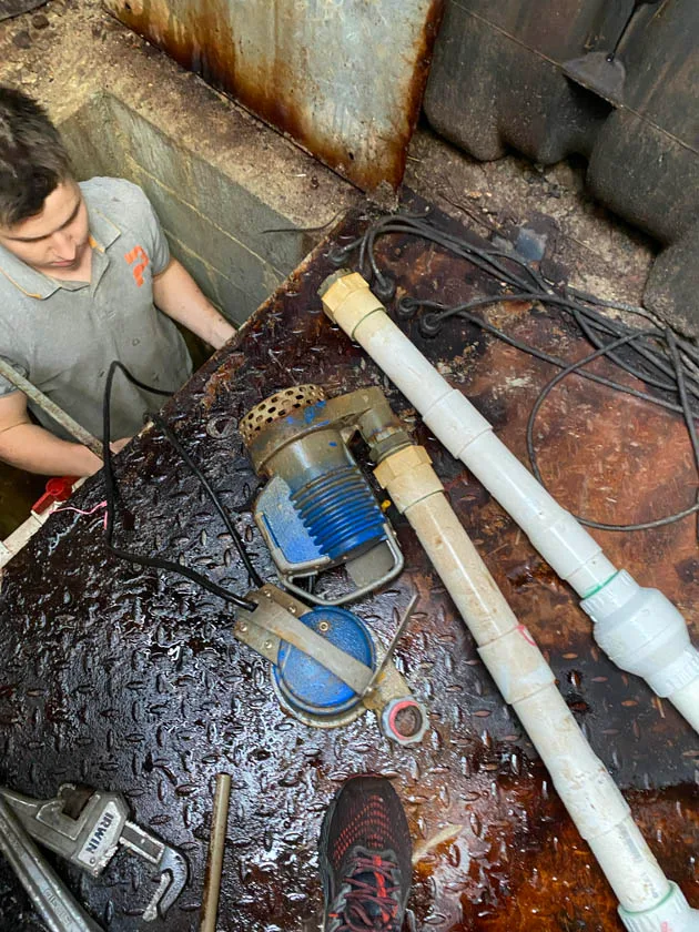 Servicing a pump-out pit below floor level